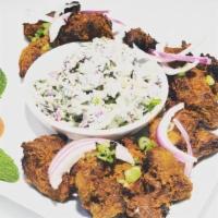 Chicken Sekuwa · Marinated chicken in Himalayan herbs and spices. Cooked in Tandoor oven on skewers. Served w...