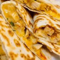 Quesadilla · Flour tortilla, choice of meat, cheese (fresh guacamole and sour cream on the side).