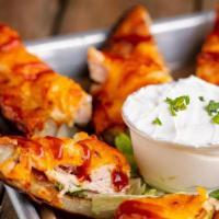 Stuffed Potato Skins · Guacamole, cheddar jack cheese with choice of pulled pork, pulled chicken, or bacon and serv...