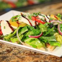 Caprese · Our flatbread basted with our famous skip’s dip and topped with romaine lettuce tossed in It...