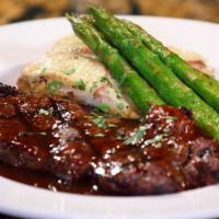 New York Steak · 10oz of premium Angus boneless New York strip charbroiled served with demi-glace, scalloped ...