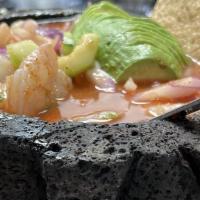 Aguachile · Raw shrimp cooked in lime juice and spicy sauce served with chips or tostadas.
