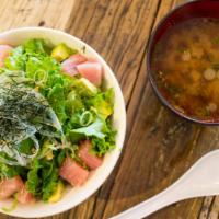 Tuna Poke Bowl · Cut tuna, lettuce, sesame, seaweed, avocado, sliced onions, green onions, poke sauce, served...