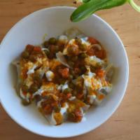 Mantu · Steamed dumplings, stuffed with ground beef, onions, and spices, topped with special yogurt ...