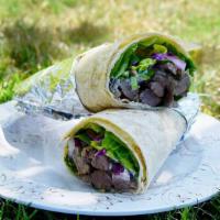 Steak Wrap · Grilled tri-tip, onions, lettuce, tomatoes, and house-made yogurt sauce.