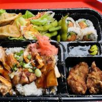 Salmon Bento Box · Includes rice, salad, potstickers, sesame chicken, edamame, and choice of sushi roll
