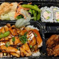Katsu Bento Box · Includes rice, salad, potstickers, sesame chicken, edamame, and choice of sushi roll