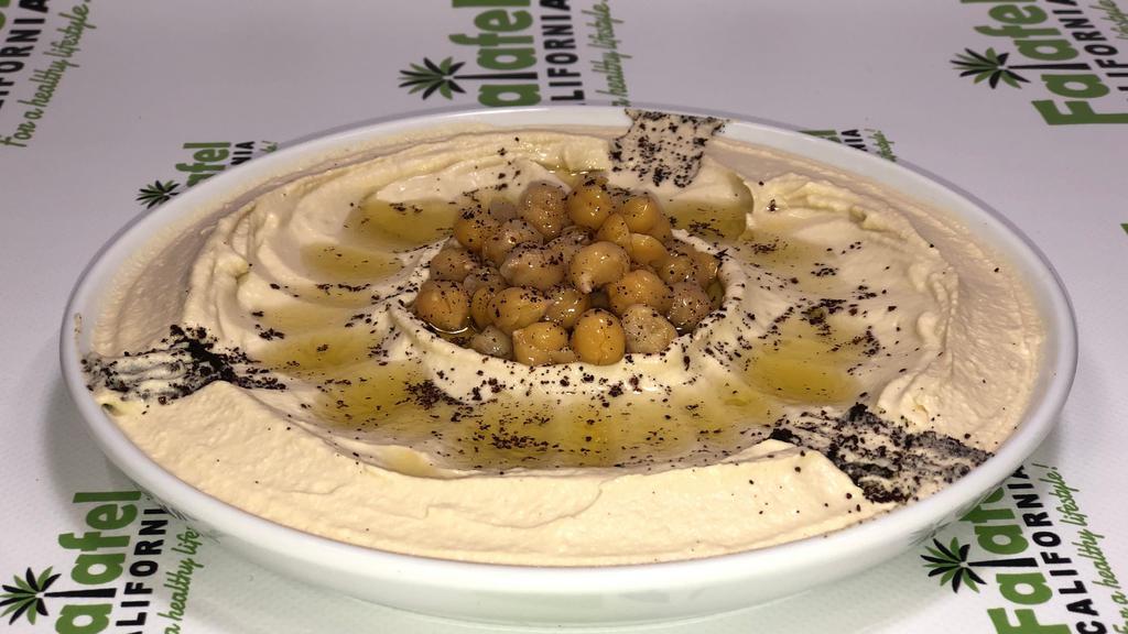  Shawarma Hummus  · Your Choice of Shawarma Beef or Chicken added on top of our delicious Hummus, Tomato, Onion and Garnish of Garlic Sauce, Cucumber Sauce, Tahini Sauce, Spicy Sauce (Shatta) and Parsley with Sumac.