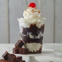Fudge Brownie Delight · Vanilla ice cream, brownies, fudge, whipped cream, peanuts, and maraschino cherry on top (12...