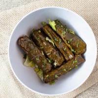 Grape Leaves · 5 pieces. Stuffed with rice, parsley, finely diced tomatoes and fresh lemon juice.