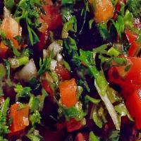 Tabouleh · Finely chopped parsley, cracked wheat, tomatoes, lemon juice and olive oil
