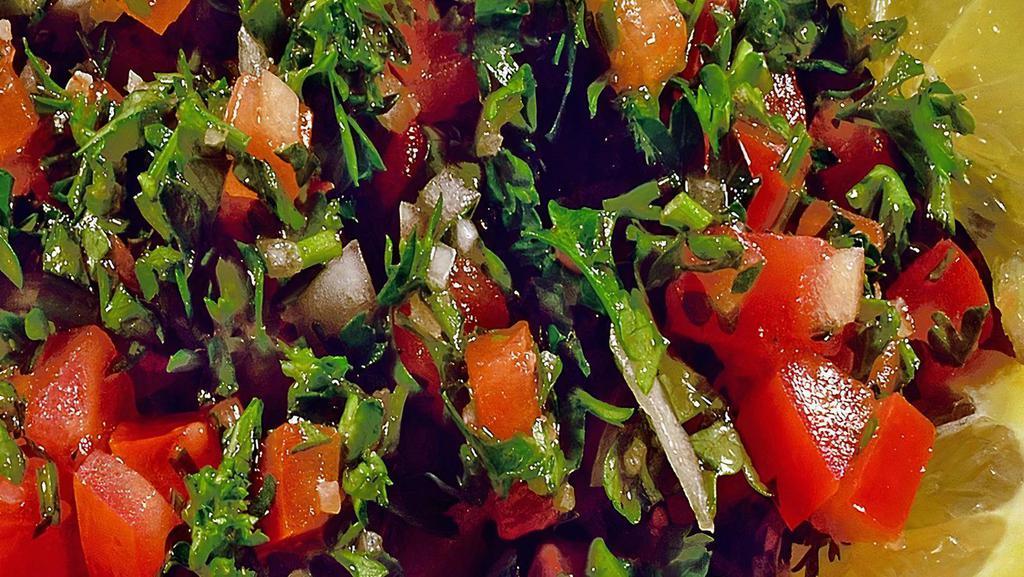 Tabouleh · Finely chopped parsley, cracked wheat, tomatoes, lemon juice and olive oil