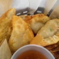 Half Moon Puff (7 Pieces) · Golden Fried curry puff stuffed with potato, carrot, and pea, served with sweet & sour sauce.