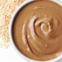 Tahini Sauce · 100% ground hulled sesame seeds blended together with lemon juice and garlic.