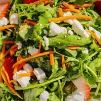 Salad · Arugula, goat cheese, candied pecans, carrots & strawberries. Served with champagne vinagret...