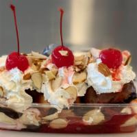 Banana Split · Three scoop ice cream chocolate syrup strawberry caramel whipped cream Almonds cherry on the...