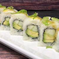 Yuzu Lemon Halibut Roll · Cucumber avo roll halibut and lemon on top