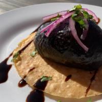 Tostada Tortuga · Shrimp ceviche with chopped avocado and aguachile sauce