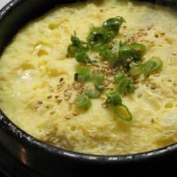 Gyeran Jjim 계란찜 · Steamed egg casserole with scallion and sesame seeds on top