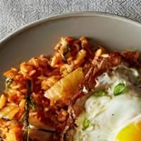 Kimchi Fried Rice · Wok-fried rice with kimchi, onion, zucchini, carrots