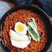 Bibim Naeng Myun 비빔냉면 · Thin and chewy Arrowroot noodle without broth topped with cucumber, pickled radish, hard-boi...