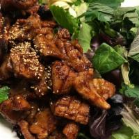Spicy Pork Dweji Galbi 숯불양념돼지갈비 · Grilled spicy sauce marinated pork rib(16oz) Served with spring mix salad, sesame leaf, slic...
