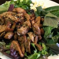 Spicy Dak Galbi 숯불양념닭갈비 · Grilled spicy marinated(18oz) chicken served with spring mix salad, sesame leaf, sliced garl...