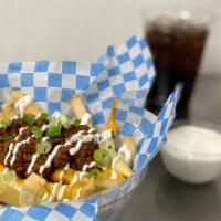 Chili Cheese Fries · (Fries topped with nacho cheese, beef chili beans, sour cream & green onion).