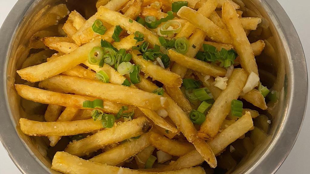 Garlic Fries · Crispy fries, garlic, parmesan and green onions.
