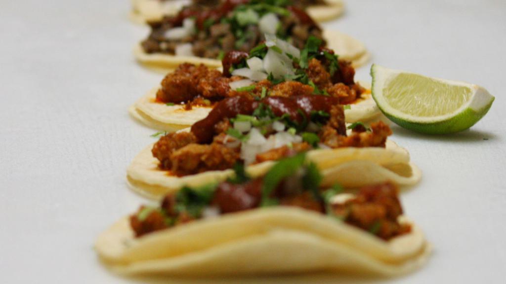 Taco · (Soft corn tortilla, choice of meat, cilantro, onion, lime & red salsa).