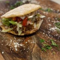 Gordita · (Deep fried corn flour crusts filled with refried beans, lettuce, pico de gallo, cotija chee...