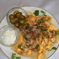 Nachos Al Verde · (Tortilla Chips, topped with nacho cheese, mozzarella cheese, choice of meat, refried beans,...