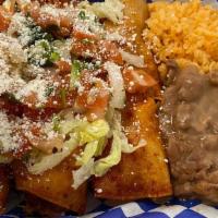 Enchiladas · Three corn tortillas with shredded chicken and red sauce