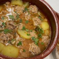 Albondigas Soup · Ground beef meatball soup, potatoes, lime, onion, and cilantro.
