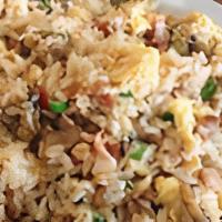 Chicken Fried Rice · Stir fried rice, scrambled egg, mushroom, green onion, and soy sauce.