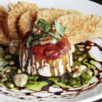 Timbale · Goat cheese, roasted peppers, balsamic reduction, pine nuts, basil, pesto.
