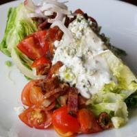 Wedge · Shallots, tomatoes, bacon, creamy and dry bleu cheese dressing.