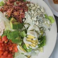 Cobb Salad · Turkey breast, bacon, diced tomato, hardboiled egg, avocado, and blue cheese crumbles with c...