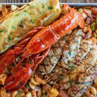 Super Tray · Medium clean shrimp, whole fried tilapia, Maine lobster, white fish fillet, and our fajita m...