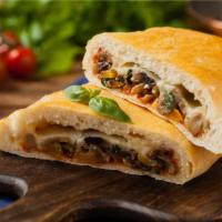Calzone With Meatballs And Garlic · Ricotta and Mozzarella Cheese, topped with Meatballs and garlic, and stuffed and folded insi...