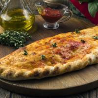 Veggie Calzone · Hand rolled pizza dough stuffed with tomato, mushroom, onion, green pepper, black olives, mo...