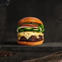 Caliente Pepper Vegan Burger · Seasoned 100% Beyond burger topped with jalapenos, melted vegan cheese, mustard, ketchup, le...
