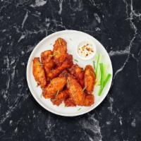 Classic Chicken Wings · Fresh vegan chicken wings breaded and fried until golden brown. Served with a side of vegan ...