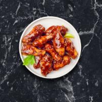 Bbq Bliss Chicken Wings · Fresh vegan chicken wings breaded, fried until golden brown, and tossed in barbecue sauce. S...