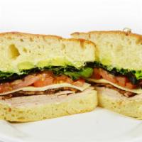 Turkey Bacon & Avocado Sandwich · Turkey breast, jack cheese, avocado, bacon, tomato, lettuce, mayo on focaccia bread.