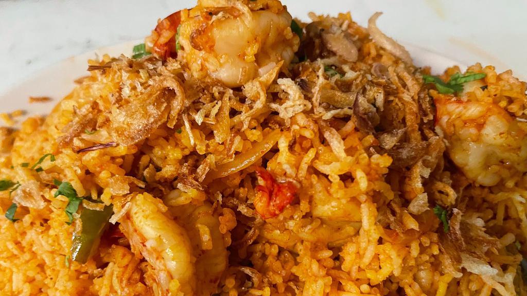 Shrimp Biryani · Spice infused aromatic basmati rice studded with shrimps.