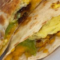 Breakfast Quesadilla  · Extra large flour tortilla layered with cheese, eggs, and choice of protein