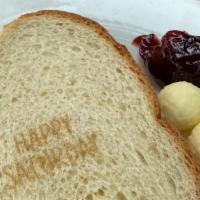 Toast · 2 large slices  sourdough or white bread
Served with a side of butter and jam