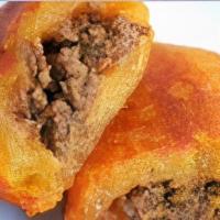 Alcapurria · Plantain based tamal like fritter filled with meat 
*Sold Frozen*