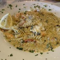 Pasta Del Mare · Salmon, prawns, and scallops sautéed in olive oil with bell peppers, fresh tomatoes and lemo...